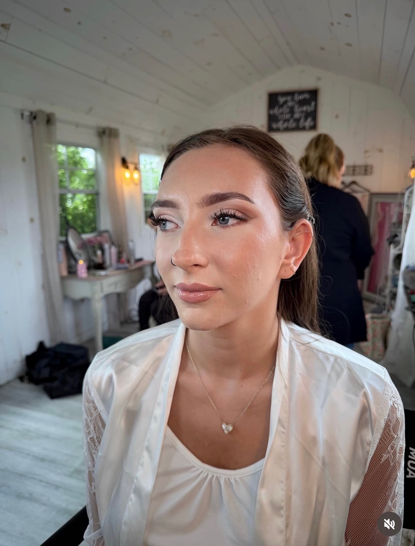 Close-up of soft glam makeup with fluttery lashes and glossy nude lip